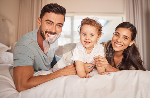 Image of Mother, father and baby boy bonding in house, family home or hotel bedroom with trust, love or security. Portrait, smile or happy Brazilian man, woman or parents with playful small son, child or kid