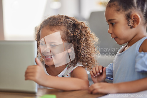 Image of Happy children with digital tablet watch education or funny cartoon videos or games on the home sofa. Latino sisters enjoy watching or learning with tech and online subscription in the living room