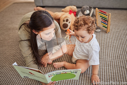 Image of Mother, baby and book for story for education on carpet in home, for learning and reading skills. Child, mom and teaching with storybook for development of mind, brain or thinking ability in house