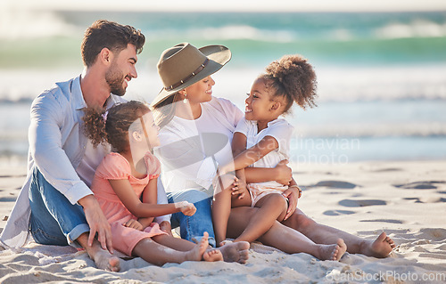 Image of Interracial family, beach vacation and travel with children and parents sitting in sand enjoying summer holiday in maldives. Man, woman and girl kids having fun and feeling happy on a tropical trip