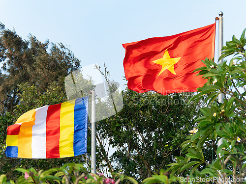 Image of Buddhist and Vietnamese flags.