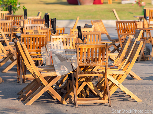 Image of Teak furniture at outdoor restaurant