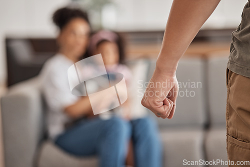 Image of Man, fist and domestic abuse of family, woman and child on home or house living room sofa. Zoom, hands and angry father or parent ready to fight in violence and anger with scared, adhd or autism kid