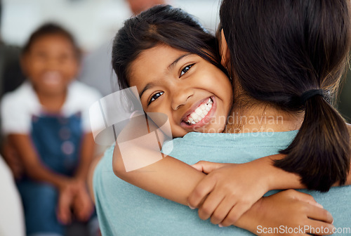 Image of Girl, mother and bonding hug in house or home living room in trust, support or security embrace. Portrait, smile or happy child in adoption success in India, mothers day celebration or family reunion