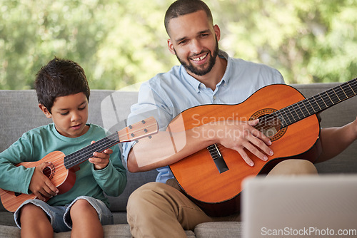 Image of Father teaching child guitar, learning music skill in brazil home and happy singing together. Acoustic musical instrument, young guitarist plays ukulele and training with musician dad in fun family