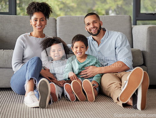 Image of Happy family, portrait and bonding on a living room floor, smile and relax in their home together. Love, children and content parents loving and enjoying the day indoors with excited, smiling kids