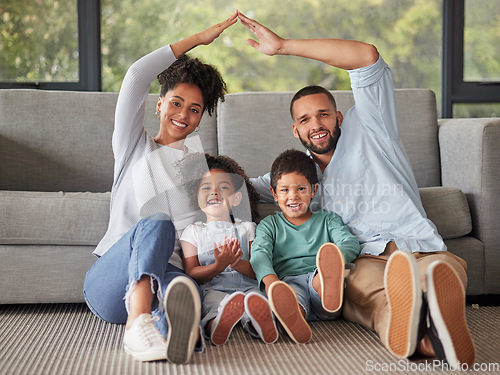 Image of Happy, family and home insurance with roof over kids for protection, family safety and care in their home. Portrait, mom and dad cover children loving, together and smile in living room on the floor