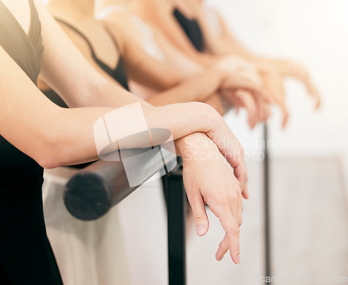 Image of Ballet, art and woman hands on a barre at a dance academy doing routine training for concert. Closeup of elegant, classical and artistic dancers practicing posture for a theater performance in studio