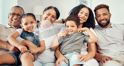 Image of Family on sofa smile with parents, children and their grandparents in home living room. Group of people with kids, mom and dad sit on couch, with happy grandma and grandpa together