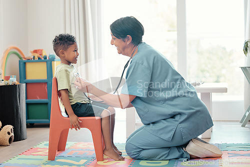 Image of Paediatrician, children doctor and consultation of a healthcare employee check heart health. Family hospital and kids medical clinic worker help with a happy smile on a cardiology consultant job