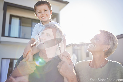 Image of Children, family and love with a boy and his grandparents playing outside in the garden of their home during a visit. Kids, happy and senior with a male child on the shoulders of his grandfather