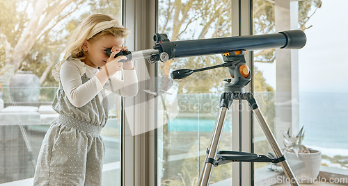 Image of Children, telescope and astrology with a girl looking at the sky or stars through a scope in her house. Astronomy, science and imagination with a young female child stargazing in her home alone