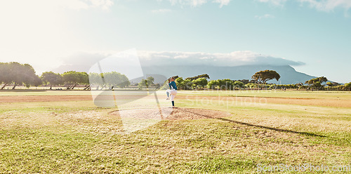 Image of Panoramic of pitcher on field for a game of baseball, ready to pitch and throw the ball. Baseball player standing alone on pitchers mound on baseball field for practice, training and sports match