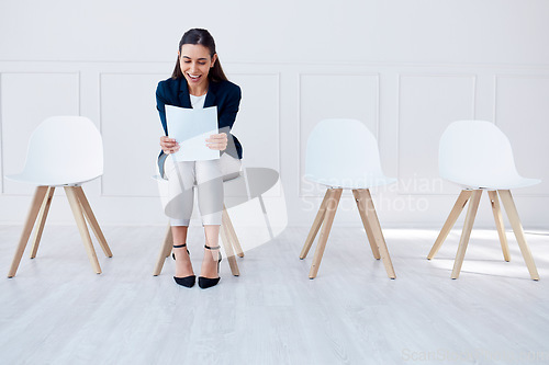 Image of Paper, recruitment and hiring of business woman in a waiting room for a corporate company job interview. Excited, smile and contract for job success, promotion or new career while reading a document