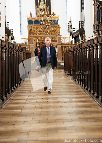 Image of Walking, aisle and senior man in a church for sightseeing on a weekend trip, vacation or holiday. Portrait, religion and holy elderly male person in retirement in a worship cathedral in the city.