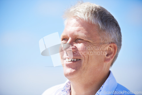 Image of Face, thinking and happy senior man outdoor for travel, freedom or journey on blue sky background. Smile, relax and elderly male person outside with gratitude for fresh air, retirement or vacation