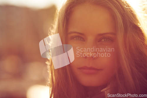 Image of Portrait, beauty and woman outdoor at sunset on mockup space, holiday or travel on vacation. Face, serious and young person or girl in nature, confident and summer sunshine for freedom in Switzerland