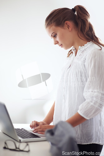 Image of College student, reading and morning in home with laptop, online communication and check email. Computer, remote work and woman typing on keyboard or planning schedule, education and elearning