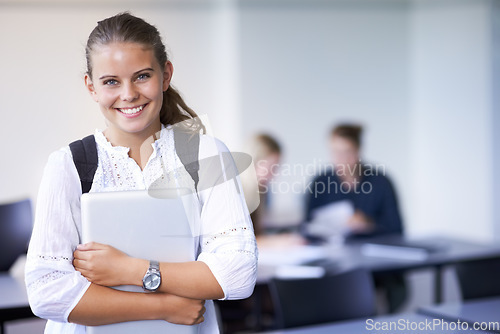 Image of Girl, portrait and teenager with laptop in classroom, back to school and excited for learning. Academy, student and happy face with computer or tech for education, study and kid with a scholarship