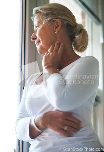 Image of Senior, woman and thinking by window with memory, remember and happy in retirement for dementia in nursing home. Elderly, person or ideas with smile, mindfulness and reflection on past life with calm