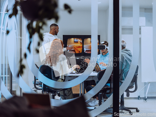 Image of A diverse group of businessmen collaborates and tests a new virtual reality technology, wearing virtual glasses, showcasing innovation and creativity in their futuristic workspace