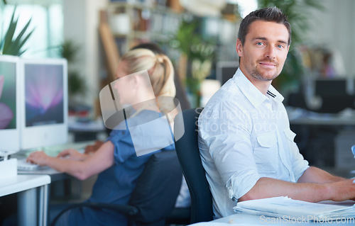 Image of Smile, happy and businessman working in the office on a creative project with documents. Professional, paperwork and young male designer planning with research information in modern workplace.