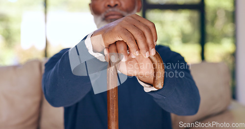 Image of Walking stick, hands and elderly man with disability, stroke rehabilitation or homecare support in retirement. Closeup, senior and wood cane for balance of parkinson, arthritis or help for healthcare