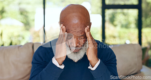 Image of Headache, senior man and stress in home for mistake, mental health or brain fog in retirement. Depressed, tired and frustrated african guy with migraine, crisis and pain of vertigo, trauma or fatigue