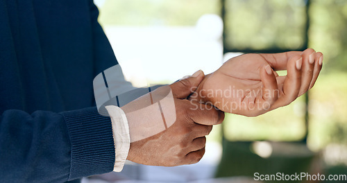 Image of Hands, wrist and pain of man with problem, carpal tunnel and joint injury at home. Closeup, healthcare risk and first aid emergency for arthritis, fibromyalgia or osteoporosis of orthopedic muscle