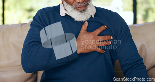 Image of Hands, elderly man and heart attack in home with pain, cardiovascular healthcare and risk of hypertension. Closeup, senior and chest with heartburn, indigestion or medical emergency of stroke on sofa