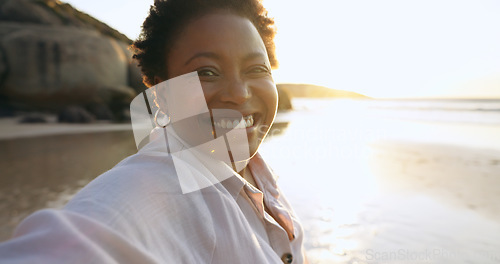 Image of Woman, selfie and smile in portrait at beach, relaxing and peace for social media, post and update on holiday. Happy black person, face and ocean on vacation, getaway and travel, fun and freedom