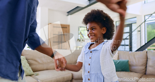 Image of Black family, dance or love with a father and daughter together on holiday in home living room. Smile, music or happy girl child holding hands with parent to relax in the house for fun celebration