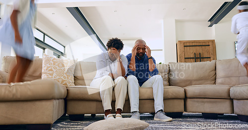 Image of Children, jump or tired parents with headache on sofa with stress, anxiety or fatigue at home. Family, chaos or frustrated people in living room with hyper kids, burnout or overwhelmed by adhd energy