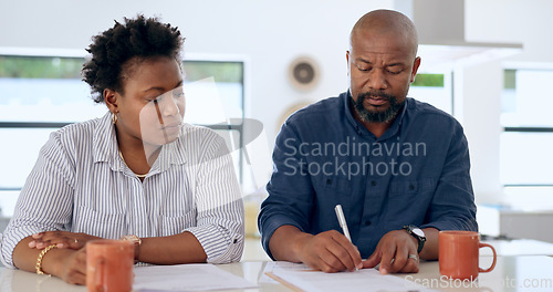 Image of Couple, married and signature with document in home for paperwork, contract or legal agreement. Black woman, man and worry for future, finances and savings by cover in safety in security for divorce