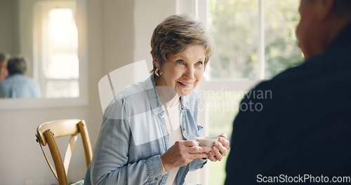 Image of Happy, coffee or elderly friends in home talking, bonding or enjoying conversation on break together. Smile, support or person in retirement speaking or drinking tea to chat with an senior woman