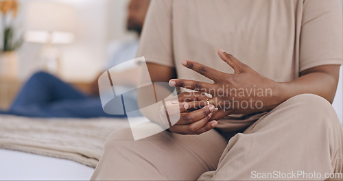 Image of Black couple, hands and ring in bed, divorce or fight for conflict, argument or disagreement at home. Closeup of African woman or man in bad marriage, toxic relationship or mistake in bedroom dispute