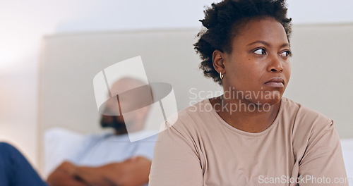 Image of Angry, divorce and black couple in home with conflict, fight or thinking about affair and marriage. African, woman or frustrated in bedroom with stress, problem or depressed from fail in relationship