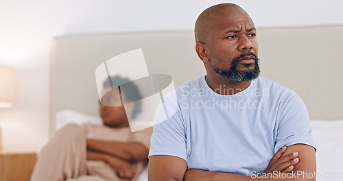 Image of Black couple, divorce and angry in home with conflict, fight or thinking about affair and heartbreak. African, man or frustrated with arms crossed in bedroom with stress, problem or fail in marriage