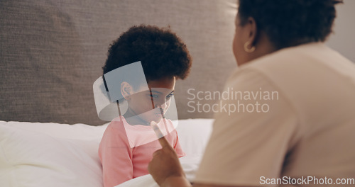 Image of Mother, discipline and girl child in bedroom with strict parent talking or grounding to stop bad behaviour. Angry, family or frustrated African mom scolding a naughty kid with punishment in home