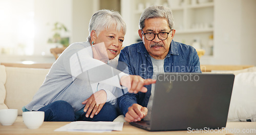 Image of Senior, couple and planning on laptop in living room with document for finances, investment or retirement. Elderly man, woman and pointing by technology for online banking, account balance or savings