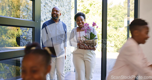 Image of Happy family, children and walk by door in new home in excitement for real estate, property investment or flower plant. Black man, woman and kids with motion blur for relocation, moving or together