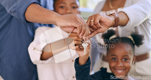 Image of Family, children and hands for key in new house for real estate, property investment or mortgage loan in closeup. Happiness, homeowner and excited for new beginning with love, care or hope for future