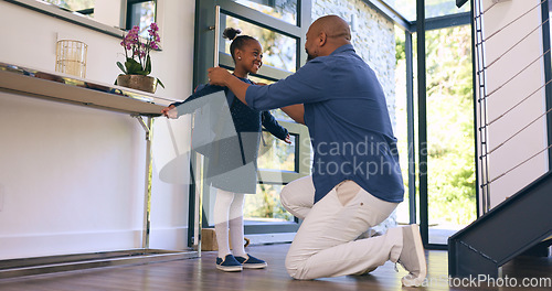 Image of Back to school, getting ready and a girl student with her dad in their apartment together to say goodbye. Black family, kids and a man parent helping his daughter with her backpack while leaving home