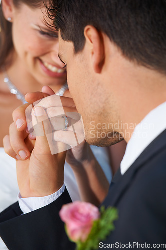 Image of Couple, wedding ring and hand in marriage with bride and smile at celebration and trust event. Flower, loyalty and care with romance and holding hands with love and commitment with woman and man