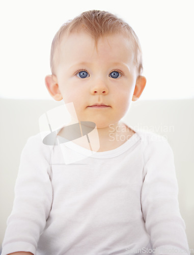 Image of Home, bed and portrait of baby relax, resting and calm in nursery for sleeping or wake up in morning. Family, youth and face of infant newborn in bedroom for child development, growth and wellness