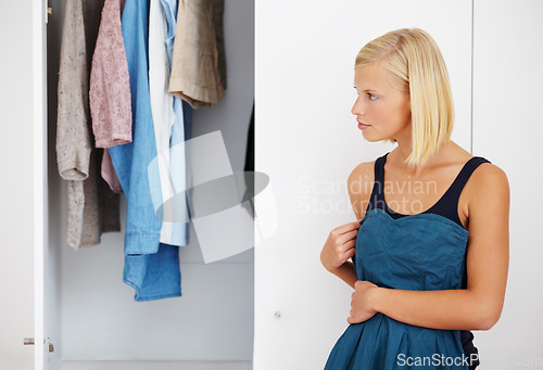 Image of Woman, mirror or choosing clothes in closet for morning routine, fashion or clothing in bedroom of home. Person, outfit selection or decision for dress, garment idea or style in wardrobe or apartment