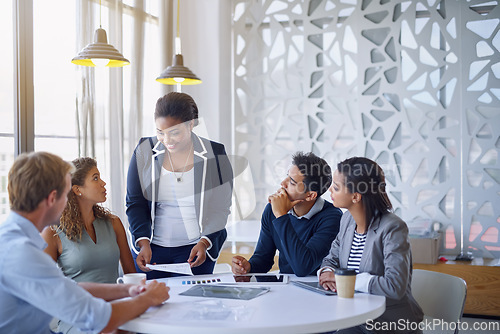 Image of Business people, meeting and discussion in office for planning, collaboration and documents or happy. Employees, men and women at corporate workplace with communication and brainstorming with smile