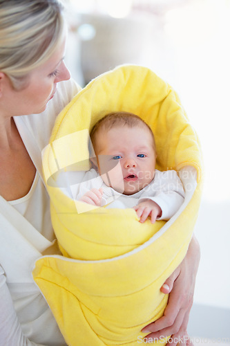 Image of Mother, parent and baby with blanket, love or bonding together in a bed with happiness, laughing and care. Mom, kid and single mum in a home, relax or maternal with little newborn, infant or child