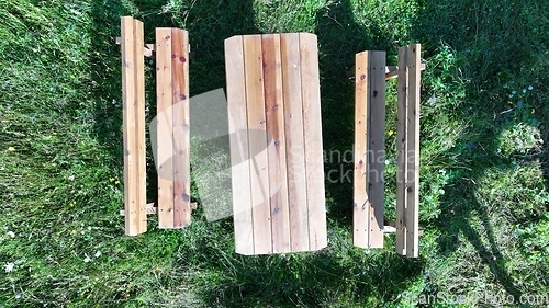 Image of Rustic wooden picnic table in the backyard top view