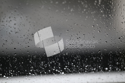 Image of Water drops on fogged glass with a gray brightness gradient